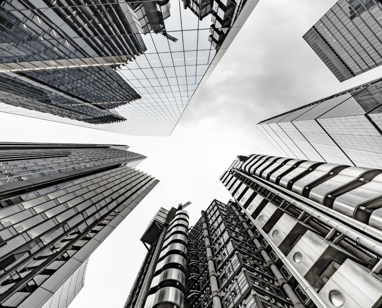 Upward view of glass and steel skyscrapers in a financial district